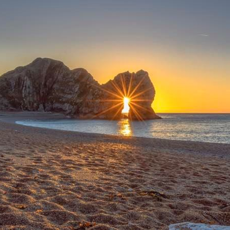 The world famous Durdle Door at sunrise